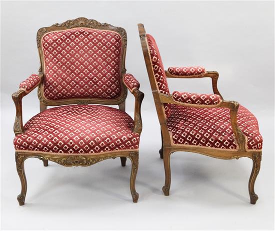 A pair of Louis XV style walnut fauteuils,